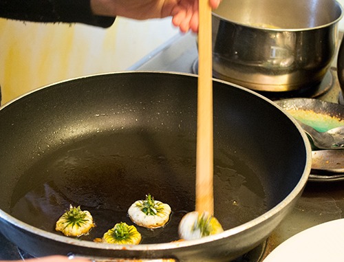 Dandelion tops in pancake batter